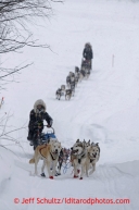 Kristi Berington leads her twin sister Anna up the bank from the Takotna River into the Takotna checkpoint Wednesday March 6, 2013.Iditarod Sled Dog Race 2013Photo by Jeff Schultz copyright 2013 DO NOT REPRODUCE WITHOUT PERMISSION