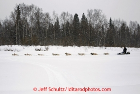 Jim Lanier runs on the Takotna River two miles from the checkpoint in the early morning Wednesday March 6, 2013.Iditarod Sled Dog Race 2013Photo by Jeff Schultz copyright 2013 DO NOT REPRODUCE WITHOUT PERMISSION