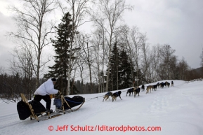 Martin Buser at team run on the road leaving the Takotna checkpoint Wednesday March 6, 2013.Iditarod Sled Dog Race 2013Photo by Jeff Schultz copyright 2013 DO NOT REPRODUCE WITHOUT PERMISSION