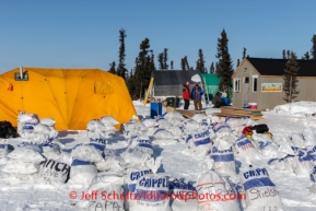 Food drop bags await mushers at the Cripple checkpoint, Thursday, March 6, during the Iditarod Sled Dog Race 2014.PHOTO (c) BY JEFF SCHULTZ/IditarodPhotos.com -- REPRODUCTION PROHIBITED WITHOUT PERMISSION