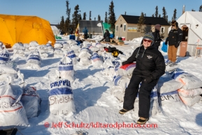 Iditarod communications director, Andi Mallard, takes a rare and quick break at the Cripple checkpoint while waiting for a flight down the trail on Thursday, March 6, during the Iditarod Sled Dog Race 2014.PHOTO (c) BY JEFF SCHULTZ/IditarodPhotos.com -- REPRODUCTION PROHIBITED WITHOUT PERMISSION