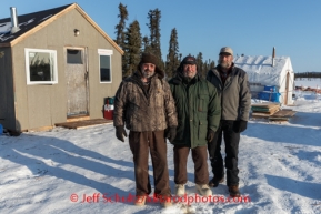 Volunteer checkpoint builders ( L - R ) Dale Schmoll, Jim Paulus and Chris Kelley stop for a photo at the Cripple checkpoint, Thursday, March 6, during the Iditarod Sled Dog Race 2014.PHOTO (c) BY JEFF SCHULTZ/IditarodPhotos.com -- REPRODUCTION PROHIBITED WITHOUT PERMISSION