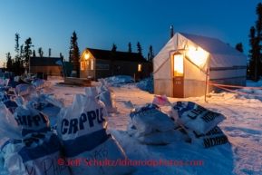 The temporary tent camp set up by Jim Paulus and crew glow at dusk at the Cripple checkpoint, Thursday, March 6, during the Iditarod Sled Dog Race 2014.PHOTO (c) BY JEFF SCHULTZ/IditarodPhotos.com -- REPRODUCTION PROHIBITED WITHOUT PERMISSION