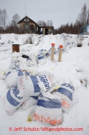 Musher food bags, lined up in alphabetical order, line the path to the main cabin at the halfway checkpoint of Iditarod on Thursday March 7, 2013.Iditarod Sled Dog Race 2013Photo by Jeff Schultz copyright 2013 DO NOT REPRODUCE WITHOUT PERMISSION