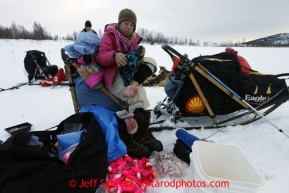 DeeDee Jonrowe dries her feet and puts on dry socks after crossing several creeks on the trail into the halfway checkpoint of Iditarod on Thursday March 7, 2013.

Iditarod Sled Dog Race 2013

Photo by Jeff Schultz copyright 2013 DO NOT REPRODUCE WITHOUT PERMISSION