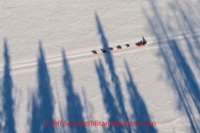 A musher and his dog team travel along the Yukon River from Ruby toward Galena on Friday, March 7, during the Iditarod Sled Dog Race 2014.PHOTO (c) BY JEFF SCHULTZ/IditarodPhotos.com -- REPRODUCTION PROHIBITED WITHOUT PERMISSION