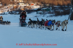 Richie Diehl leads Peter Kaiser down the Yukon river with Ruby in the background on Friday, March 7, during the Iditarod Sled Dog Race 2014.PHOTO (c) BY JEFF SCHULTZ/IditarodPhotos.com -- REPRODUCTION PROHIBITED WITHOUT PERMISSION