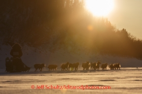 Richie Diehl runs down the Yukon river shortly after leaving the Ruby checkpoint at sunset on Friday, March 7, during the Iditarod Sled Dog Race 2014.PHOTO (c) BY JEFF SCHULTZ/IditarodPhotos.com -- REPRODUCTION PROHIBITED WITHOUT PERMISSION