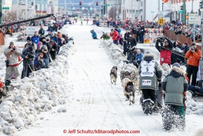 Lachlan Clarke runs down 4th avenue during the cermonial start day of Iditarod 2015. Saturday March 7, 2015(C) Jeff Schultz/SchultzPhoto.com - ALL RIGHTS RESERVED DUPLICATION  PROHIBITED  WITHOUT  PERMISSION