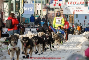 Nicolas Petit leaves the start line on 4th avenue during the cermonial start day of Iditarod 2015 in Anchorage, Alaska. Saturday March 7, 2015(C) Jeff Schultz/SchultzPhoto.com - ALL RIGHTS RESERVED DUPLICATION  PROHIBITED  WITHOUT  PERMISSION