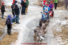 Travis Beals runs down a bare stretch of trail along the bike/ski trail during the cermonial start day of Iditarod 2015 in Anchorage, Alaska. Saturday March 7, 2015(C) Jeff Schultz/SchultzPhoto.com - ALL RIGHTS RESERVED DUPLICATION  PROHIBITED  WITHOUT  PERMISSION