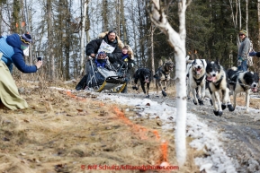 Mike Santos concentrates on the trail as he runs down a bare stretch along the bike/ski trail during the cermonial start day of Iditarod 2015 in Anchorage, Alaska. Saturday March 7, 2015(C) Jeff Schultz/SchultzPhoto.com - ALL RIGHTS RESERVED DUPLICATION  PROHIBITED  WITHOUT  PERMISSION