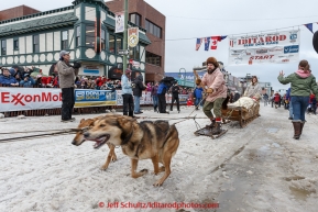 Wells Fargo Centennial frieght sled led by Josheph Robertia (front) and Rod Perry driving the team leave the Anchorage start line during the cermonial start day of Iditarod 2015. Saturday March 7, 2015(C) Jeff Schultz/SchultzPhoto.com - ALL RIGHTS RESERVED DUPLICATION  PROHIBITED  WITHOUT  PERMISSION