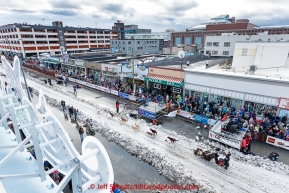 Scott Janssen runs down 4th avenue during the cermonial start day of Iditarod 2015 in Anchorage, Alaska. Saturday March 7, 2015(C) Jeff Schultz/SchultzPhoto.com - ALL RIGHTS RESERVED DUPLICATION  PROHIBITED  WITHOUT  PERMISSION