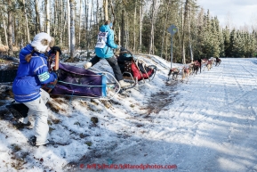 Anna Berington and handler take a tight turn at Goose Lake during the cermonial start day of Iditarod 2015 in Anchorage, Alaska. Saturday March 7, 2015(C) Jeff Schultz/SchultzPhoto.com - ALL RIGHTS RESERVED DUPLICATION  PROHIBITED  WITHOUT  PERMISSION