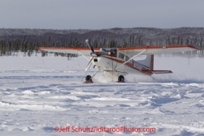 Thursday March, 2012   Volunteer Iditarod pilot Diana Morony lands at the Cripple checkpoint.   Iditarod 2012.