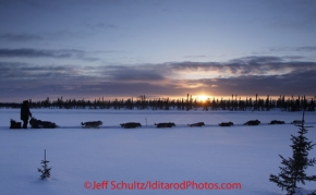 Thursday March, 2012  Sonny Lindner runs near the Cripple checkpoint at sunset   Iditarod 2012.