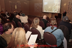 January 8, 2013   Communications volunteer ,Andi Mallard, talks with potential and returning Iditarod volunteers  at a pre-race meeting for volunteers at the Millenium Hotel Redington Ballroom to discuss postions for this year's Iditarod race to begin March 2nd in downtown Anchorage.