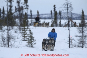 Travis Beals leads Matt Giblin on the trail into the halfway checkpoint of Iditarod on Friday March 8, 2013.Iditarod Sled Dog Race 2013Photo by Jeff Schultz copyright 2013 DO NOT REPRODUCE WITHOUT PERMISSION