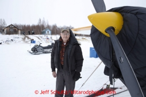 Pilot Jim Kintz waits for a load of dropped dogs at the halfway checkpoint of Iditarod on Friday March 8, 2013.Iditarod Sled Dog Race 2013Photo by Jeff Schultz copyright 2013 DO NOT REPRODUCE WITHOUT PERMISSION