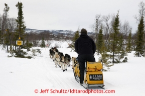 Matt Giblin passes a BLM sign for IDITAROD (City) on the trail into the halfway checkpoint of Iditarod on Friday March 8, 2013.Iditarod Sled Dog Race 2013Photo by Jeff Schultz copyright 2013 DO NOT REPRODUCE WITHOUT PERMISSION