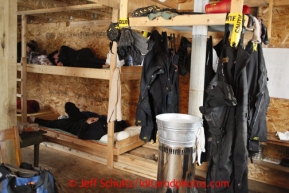 Musher's gear dries in the musher cabin at Iditarod after being soaked in 4 open-water creek crossings between Ophir and the halfway checkpoint of Iditarod on Friday March 8, 2013.Iditarod Sled Dog Race 2013Photo by Jeff Schultz copyright 2013 DO NOT REPRODUCE WITHOUT PERMISSION