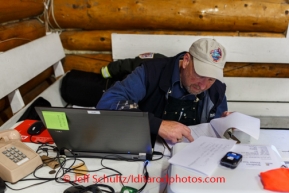 Race volunteer communications specialist Troy Zachary sends traffic from Ruby on Saturday March 8, during the Iditarod Sled Dog Race 2014.PHOTO (c) BY JEFF SCHULTZ/IditarodPhotos.com -- REPRODUCTION PROHIBITED WITHOUT PERMISSION