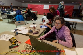 Volunteer comms Veronica Beagan works the station at Galena on Saturday March 8, during the Iditarod Sled Dog Race 2014.PHOTO (c) BY JEFF SCHULTZ/IditarodPhotos.com -- REPRODUCTION PROHIBITED WITHOUT PERMISSION