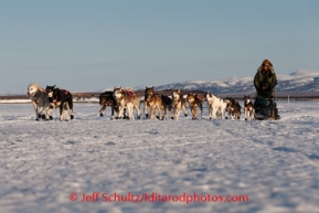 Sonny Lindner runs on the slough ice just before Unalakleet on Saturday March 8, during the Iditarod Sled Dog Race 2014.PHOTO (c) BY JEFF SCHULTZ/IditarodPhotos.com -- REPRODUCTION PROHIBITED WITHOUT PERMISSION