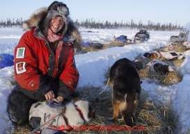 Friday March 9, 2012  Ryne Olson puts on dog salve at the half-way checkpoint at Cripple.   Iditarod 2012.