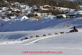 Friday March 9, 2012  Dallas Seavey runs down the bank onto the the Yukon River at the village of Ruby, Alaska. Iditarod 2012.