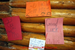 Friday March 9, 2012   Encourging signs for the mushers line the community center walls at the Ruby checkpoint. Iditarod 2012.