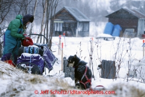 Angie Taggart packs her sled as she prepares to leave the halfway checkpoint of Iditarod on Saturday March 9, 2013.Iditarod Sled Dog Race 2013Photo by Jeff Schultz copyright 2013 DO NOT REPRODUCE WITHOUT PERMISSION