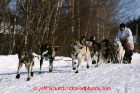 Gerry Sousa drives his team out of Shageluk and heads north on Saturday March 9, 2013.Iditarod Sled Dog Race 2013Photo by Jeff Schultz copyright 2013 DO NOT REPRODUCE WITHOUT PERMISSION