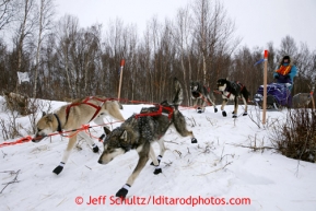 Angie Taggart leaves the checkpoint of Iditarod on Saturday March 9, 2013.Iditarod Sled Dog Race 2013Photo by Jeff Schultz copyright 2013 DO NOT REPRODUCE WITHOUT PERMISSION