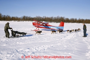 Rudy Demoski passes volunteer pilot Ed Kornfield's plane on the river after leaving Shageluk Saturday March 9, 2013.