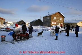 Aily Zirle checks in and out quickly at the Kaltag checkpoint on Saturday March 9, 2013.Iditarod Sled Dog Race 2013Photo by Jeff Schultz copyright 2013 DO NOT REPRODUCE WITHOUT PERMISSION