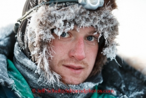 Wade Marrs is frosted up after his arrival into Unalakleet on Sunday, March 9, during the Iditarod Sled Dog Race 2014.PHOTO (c) BY JEFF SCHULTZ/IditarodPhotos.com -- REPRODUCTION PROHIBITED WITHOUT PERMISSION