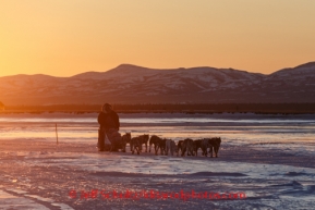 John Baker on the Unalakleet River on the way into Unalalkeet at sunrise on Sunday, March 9, during the Iditarod Sled Dog Race 2014.PHOTO (c) BY JEFF SCHULTZ/IditarodPhotos.com -- REPRODUCTION PROHIBITED WITHOUT PERMISSION