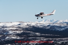 Volunteer pilot Glen Hanson flies a load along the Blueberry Hills out of Unalakleet on Sunday, March 9, during the Iditarod Sled Dog Race 2014.PHOTO (c) BY JEFF SCHULTZ/IditarodPhotos.com -- REPRODUCTION PROHIBITED WITHOUT PERMISSION