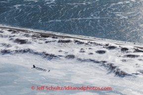 Jessie Royer on Lagoon Ice with the open water of Norton Sound in the background on the trail between Unalakleet and Shaktoolik on Sunday, March 9, during the Iditarod Sled Dog Race 2014.PHOTO (c) BY JEFF SCHULTZ/IditarodPhotos.com -- REPRODUCTION PROHIBITED WITHOUT PERMISSION