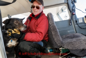 Pilot Tim Skala unloads dropped dogs at Unalakleet on Sunday, March 9, during the Iditarod Sled Dog Race 2014.PHOTO (c) BY JEFF SCHULTZ/IditarodPhotos.com -- REPRODUCTION PROHIBITED WITHOUT PERMISSION