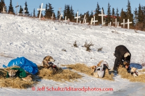 Aliy Zirkle boots her dogs before leaving Koyuk on Sunday, March 9, during the Iditarod Sled Dog Race 2014.PHOTO (c) BY JEFF SCHULTZ/IditarodPhotos.com -- REPRODUCTION PROHIBITED WITHOUT PERMISSION