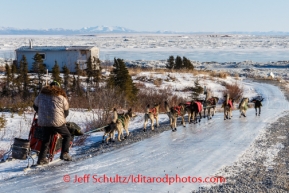 Jeff King runs down the glare ice road has he leaves Koyuk on Sunday, March 9, during the Iditarod Sled Dog Race 2014.PHOTO (c) BY JEFF SCHULTZ/IditarodPhotos.com -- REPRODUCTION PROHIBITED WITHOUT PERMISSION