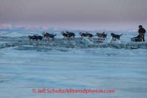 Joar Leifseth Ulsom crosses a pressure ridge on the sea ice in front of Koyuk on Sunday, March 9, during the Iditarod Sled Dog Race 2014.PHOTO (c) BY JEFF SCHULTZ/IditarodPhotos.com -- REPRODUCTION PROHIBITED WITHOUT PERMISSION