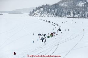 Paige Drobney runs up to spectators at the confluence of the Chena and Tanana rivers  after leaving the start line at Pike's Landing in Fairbanks on Monday March 9, 2015 during Iditarod 2015.(C) Jeff Schultz/SchultzPhoto.com - ALL RIGHTS RESERVED DUPLICATION  PROHIBITED  WITHOUT  PERMISSION