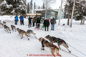 Yvonne Dabakk of Norway passes a group of spectators on Broadmoore street shortly after leaving the start of Iditarod 2015 in Fairbanks. (C) Jeff Schultz/SchultzPhoto.com - ALL RIGHTS RESERVED DUPLICATION  PROHIBITED  WITHOUT  PERMISSION