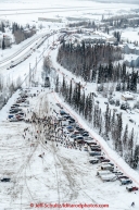 Teams line up in the staging area heading up the the start line in Fairbanks on Monday March 9 during Iditarod 2015(C) Jeff Schultz/SchultzPhoto.com - ALL RIGHTS RESERVED DUPLICATION  PROHIBITED  WITHOUT  PERMISSION