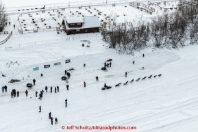 A team passes by the Kennel of Iditarod Champion the late Susan Butcher on the Chena River  after leaving the start line at Pike's Landing in Fairbanks on Monday March 9, 2015 during Iditarod 2015.(C) Jeff Schultz/SchultzPhoto.com - ALL RIGHTS RESERVED DUPLICATION  PROHIBITED  WITHOUT  PERMISSION