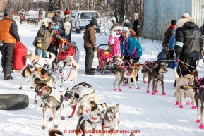 Aliy Zirkle and DeeDee Jonrowe check in side-by-side as other teams bunch up behind at the  first checkpoint in Nenana on March 9th, 2015 during the 2015 Iditarod.(C) Jeff Schultz/SchultzPhoto.com - ALL RIGHTS RESERVED DUPLICATION  PROHIBITED  WITHOUT  PERMISSION